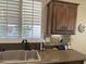 Modern kitchen sink with a double basin and oil rubbed bronze faucet at 14226 W Via Montoya --, Sun City West, AZ 85375