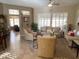 Spacious living room boasts neutral colored furniture and tile flooring at 14226 W Via Montoya --, Sun City West, AZ 85375