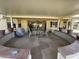 Covered patio features a stone floor, seating area, and built-in grill at 14226 W Via Montoya --, Sun City West, AZ 85375