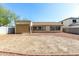 Large backyard with gravel and a covered patio area at 14400 N 136Th Ln, Surprise, AZ 85379