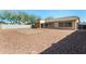 Spacious backyard with gravel and a covered patio area at 14400 N 136Th Ln, Surprise, AZ 85379