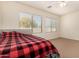 Bright bedroom with two windows and ceiling fan at 14400 N 136Th Ln, Surprise, AZ 85379