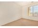 Well-lit bedroom with neutral walls and carpet at 14400 N 136Th Ln, Surprise, AZ 85379