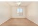 Bedroom featuring a large window and ceiling fan at 14400 N 136Th Ln, Surprise, AZ 85379