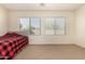 Bedroom with two windows and ceiling fan at 14400 N 136Th Ln, Surprise, AZ 85379