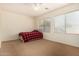 Spacious bedroom with red and black plaid bedding at 14400 N 136Th Ln, Surprise, AZ 85379