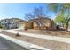 House exterior view from the street with desert landscaping at 14400 N 136Th Ln, Surprise, AZ 85379