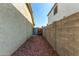 Side yard with gravel and a gate for access at 14400 N 136Th Ln, Surprise, AZ 85379