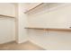 Large walk-in closet with double hanging rods and shelving at 14400 N 136Th Ln, Surprise, AZ 85379