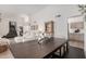 Spacious dining area with a wooden table and views into living room and kitchen at 15806 N 45Th Pl, Phoenix, AZ 85032