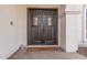 Dark brown double front doors with glass accents at 15806 N 45Th Pl, Phoenix, AZ 85032