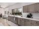 Kitchen features white countertops and taupe cabinets at 15806 N 45Th Pl, Phoenix, AZ 85032