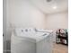 Laundry room with washer and dryer, and storage at 15806 N 45Th Pl, Phoenix, AZ 85032