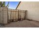 Wooden backyard gate with metal frame at 169 S Comanche Dr, Chandler, AZ 85224