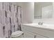 Clean bathroom with white vanity and shower/tub combo at 169 S Comanche Dr, Chandler, AZ 85224