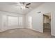 Spacious bedroom with ceiling fan and large window at 169 S Comanche Dr, Chandler, AZ 85224