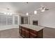 Kitchen island with granite countertop and dark wood cabinets at 169 S Comanche Dr, Chandler, AZ 85224