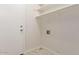 Laundry area with built-in shelving and hookups at 169 S Comanche Dr, Chandler, AZ 85224