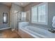 Relaxing bathroom with soaking tub and walk-in shower at 17353 N 99Th St, Scottsdale, AZ 85255