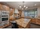 Modern kitchen with wood cabinets and granite island at 17353 N 99Th St, Scottsdale, AZ 85255