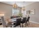 Formal dining room with a wood table, neutral decor, and ample natural light at 17353 N 99Th St, Scottsdale, AZ 85255