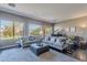 Living room with large windows, plush seating, and a view of the backyard and mountains at 17353 N 99Th St, Scottsdale, AZ 85255