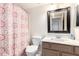 Bathroom with shower/tub combo and updated vanity at 17463 N 63Rd Dr, Glendale, AZ 85308