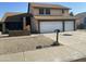 Two-story house with a two-car garage and landscaping at 17463 N 63Rd Dr, Glendale, AZ 85308