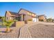 Two-story house with a landscaped walkway and garden at 17463 N 63Rd Dr, Glendale, AZ 85308