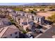 An aerial view of a suburban neighborhood featuring neat landscaping, tiled roofs, and community fields at 17749 W Woodrow Ln, Surprise, AZ 85388