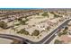 Community view showing homes, roads, and a golf course at 17802 N Bridle Ln, Surprise, AZ 85374