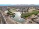 Golf course community overview with lake and houses at 17802 N Bridle Ln, Surprise, AZ 85374