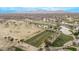 Aerial view of a golf course driving range and clubhouse at 17802 N Bridle Ln, Surprise, AZ 85374