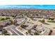 Community view showing homes, roads, and a golf course at 17802 N Bridle Ln, Surprise, AZ 85374