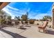 Spacious backyard with lounge chairs and a view of the golf course at 17802 N Bridle Ln, Surprise, AZ 85374