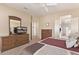 Spacious bedroom with dresser and ensuite bathroom access at 17802 N Bridle Ln, Surprise, AZ 85374