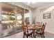 Dining area with patio access and golf course view at 17802 N Bridle Ln, Surprise, AZ 85374