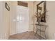 Bright entryway with decorative table and mirror at 17802 N Bridle Ln, Surprise, AZ 85374