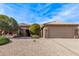 One story home with two car garage and desert landscaping at 17802 N Bridle Ln, Surprise, AZ 85374