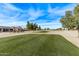 View of a beautiful golf course with homes in the background at 17802 N Bridle Ln, Surprise, AZ 85374