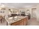 Granite kitchen island with seating and storage at 17802 N Bridle Ln, Surprise, AZ 85374