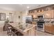 Modern kitchen with granite island and stainless steel appliances at 17802 N Bridle Ln, Surprise, AZ 85374