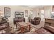 Cozy living room featuring leather furniture and a large TV at 17802 N Bridle Ln, Surprise, AZ 85374