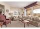 Relaxing living room with ample natural light and comfy couches at 17802 N Bridle Ln, Surprise, AZ 85374