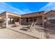 Large backyard patio with seating and a pergola at 17802 N Bridle Ln, Surprise, AZ 85374