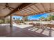 Covered patio with seating and a view of the golf course at 17802 N Bridle Ln, Surprise, AZ 85374