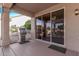 Outdoor patio with a built-in grill and sliding glass doors leading inside at 17802 N Bridle Ln, Surprise, AZ 85374