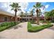 Community clubhouse with brick facade and lush landscaping at 17842 W Chuckwalla Canyon Rd, Goodyear, AZ 85338