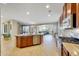 Open kitchen features island with seating and stainless steel appliances at 17842 W Chuckwalla Canyon Rd, Goodyear, AZ 85338