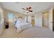 Main bedroom with en-suite bathroom and ceiling fan at 17842 W Chuckwalla Canyon Rd, Goodyear, AZ 85338